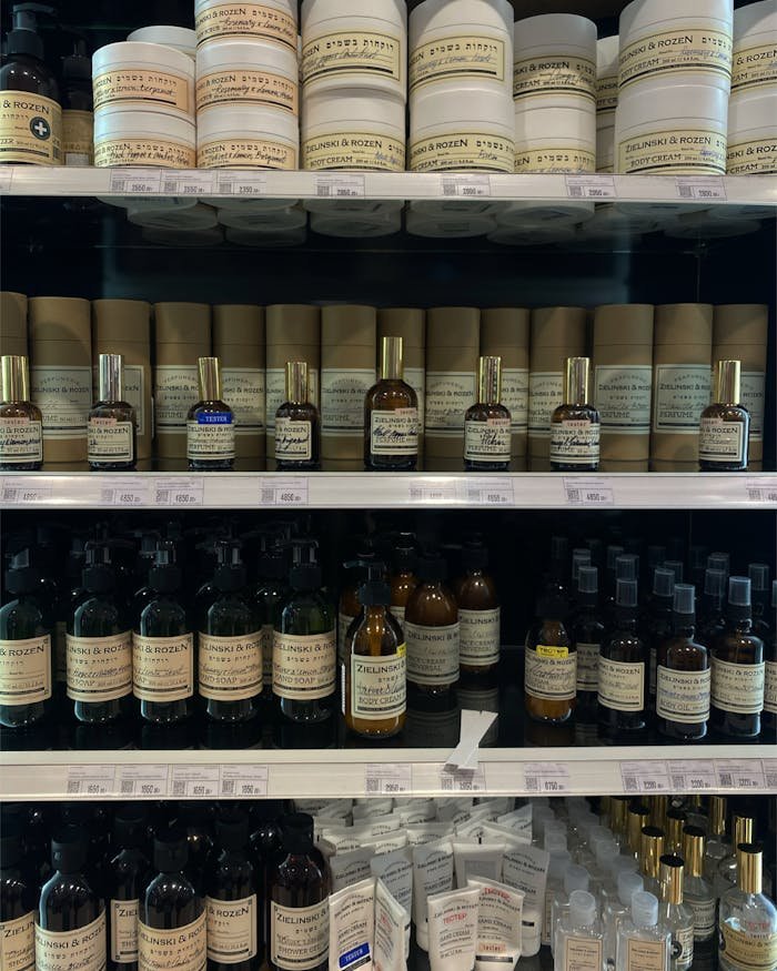 Variety of beauty products displayed on store shelves, perfect for skincare and aromatherapy enthusiasts.
